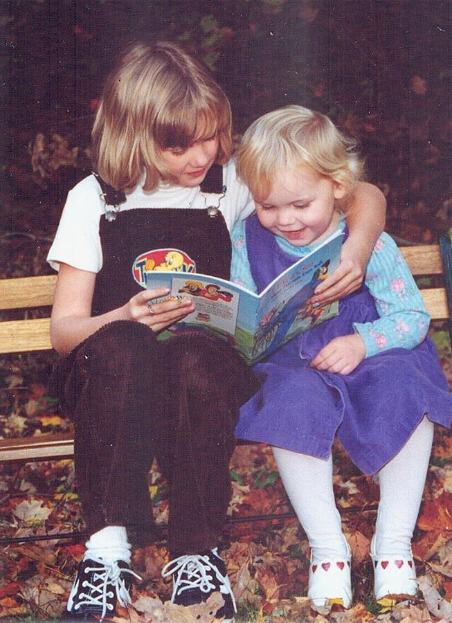 Big Sis Reading to Little Sis Photograph by Lila Mattison