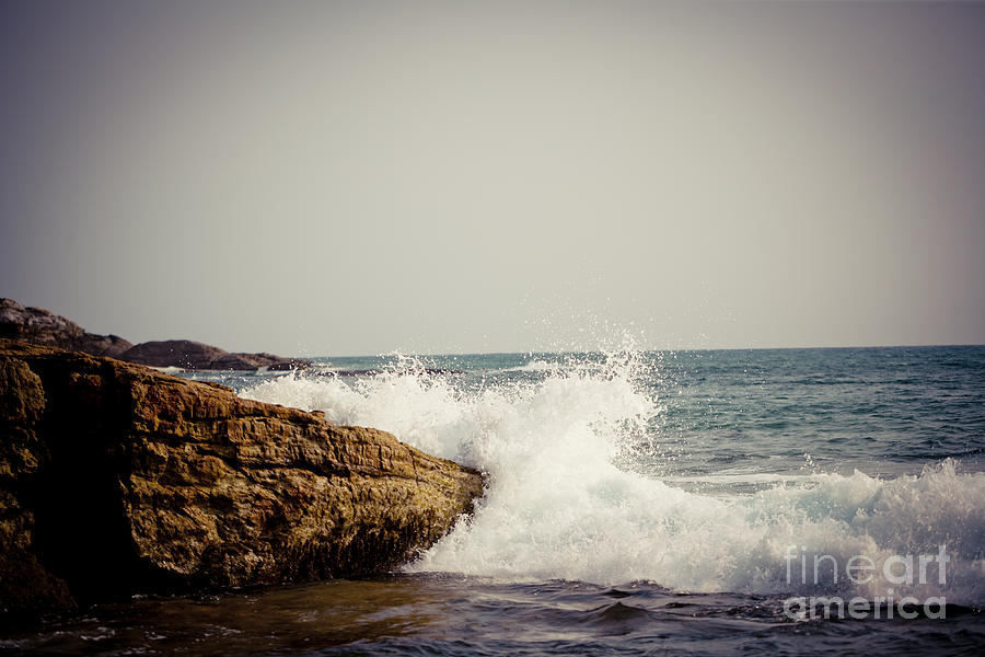 big wave and Rocky cliffs on the coast Photograph by Raimond Klavins