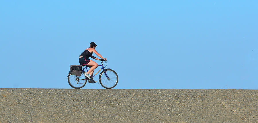 Bike Rider on Levee Photograph by Josephine Buschman