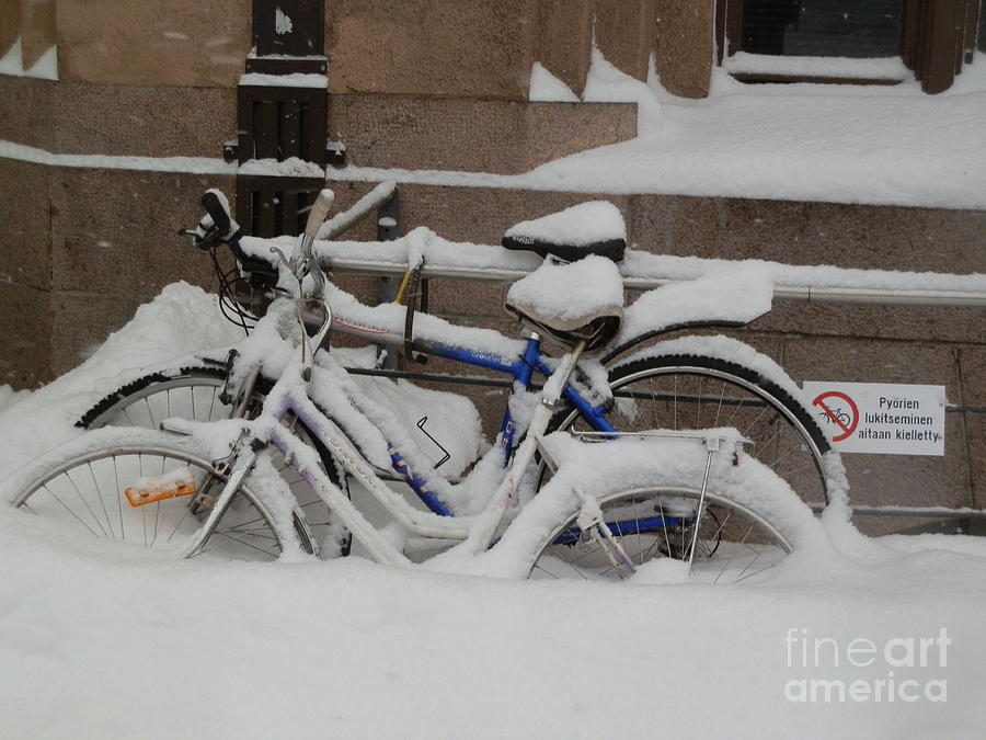 Bikes in Finnish snow Photograph by Margaret Brooks