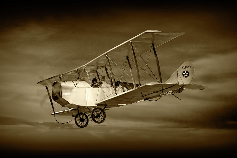 Biplane with Cloudy Sky in Sepia Tone Photograph by Randall Nyhof