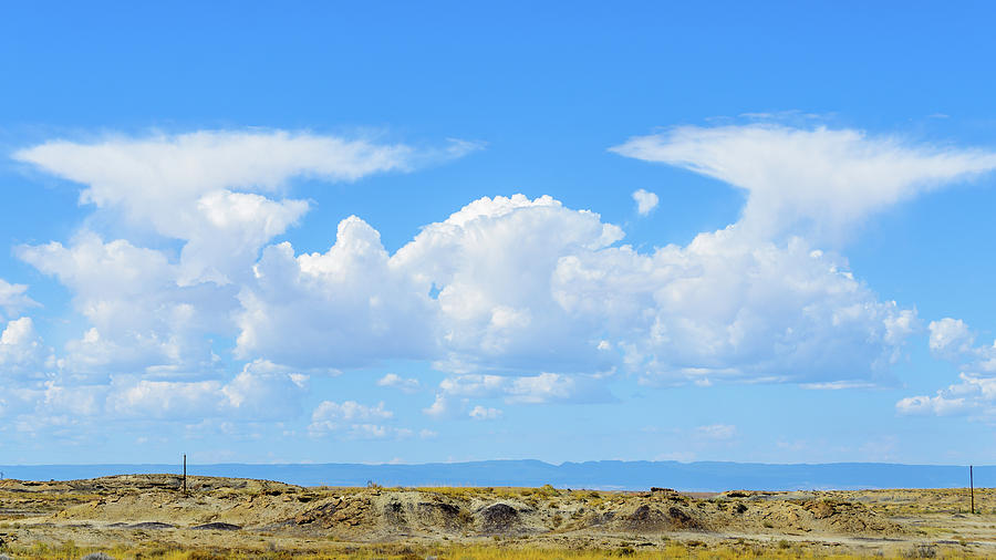 Bisti Badlands - Twin Clouds Photograph by Debra Martz