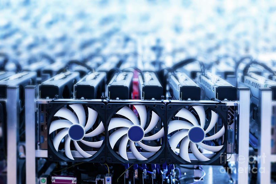 Bitcoin miner. IT device with cooling fans. Photograph by Michal Bednarek