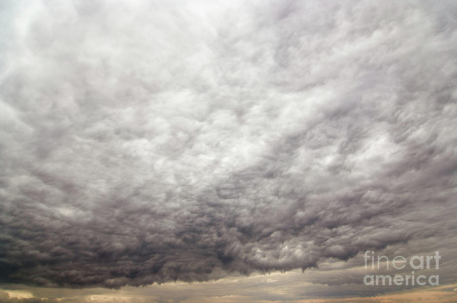 Bizarre rainy clouds Photograph by Michal Boubin