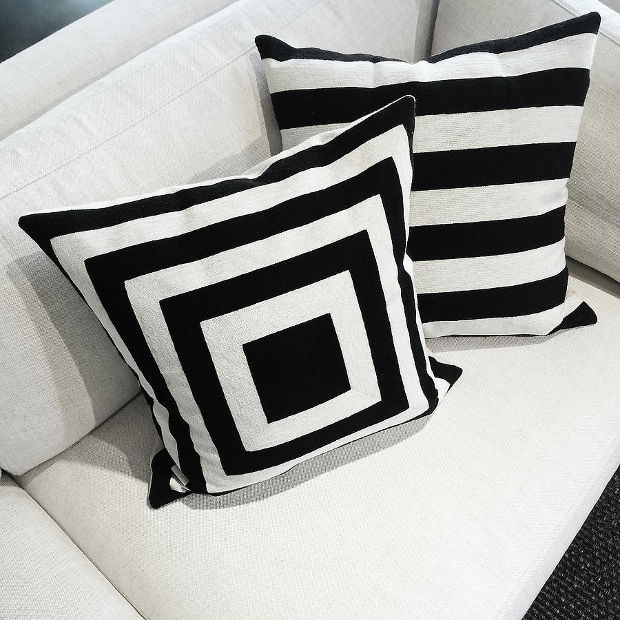 Black And White Photograph - Black and white cushions on a sofa by GoodMood Art