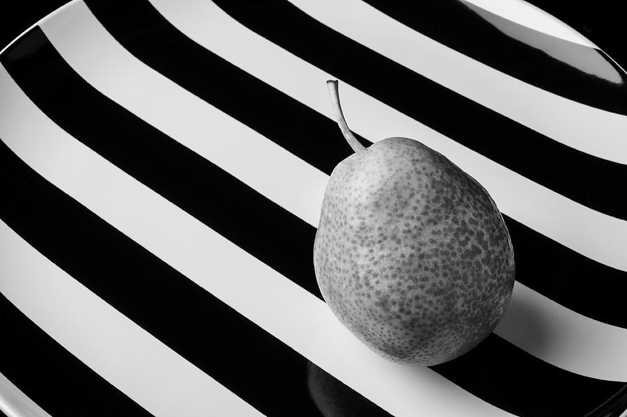 Black And White Pear On Striped Plate Photograph by Garry Gay