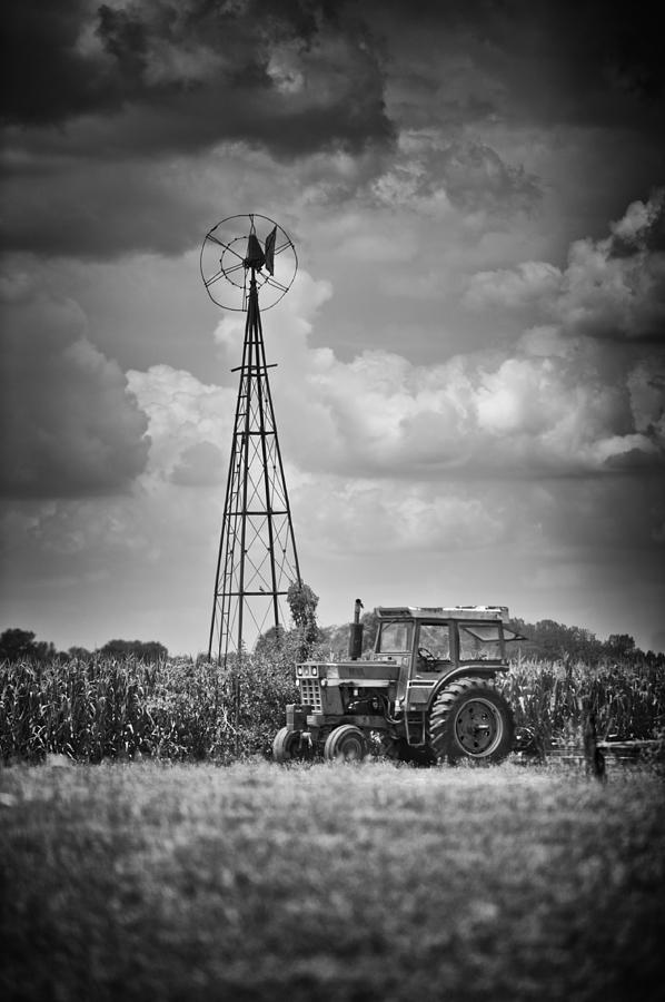 Farm Photograph - Black and White Tractor by Windmill by Brian Mollenkopf