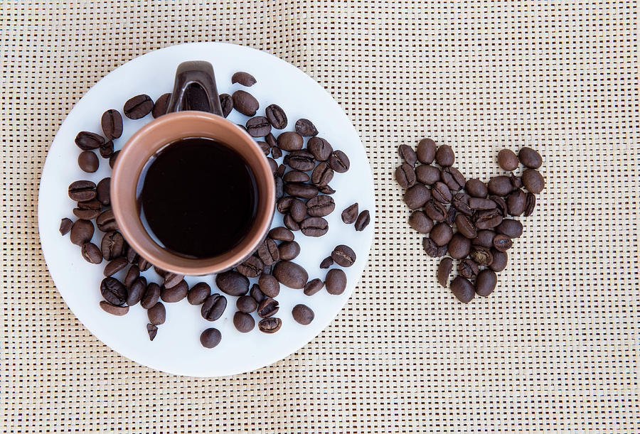 Black coffee and beans Photograph by Michalakis Ppalis