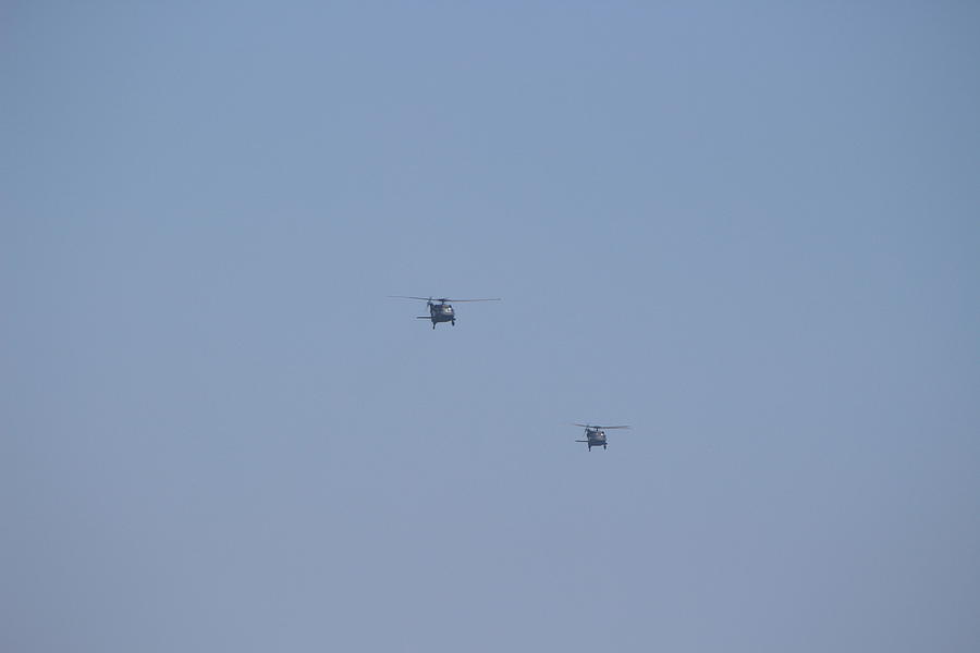 Black Hawk Flying over Huntington Beach Photograph by Colleen Cornelius