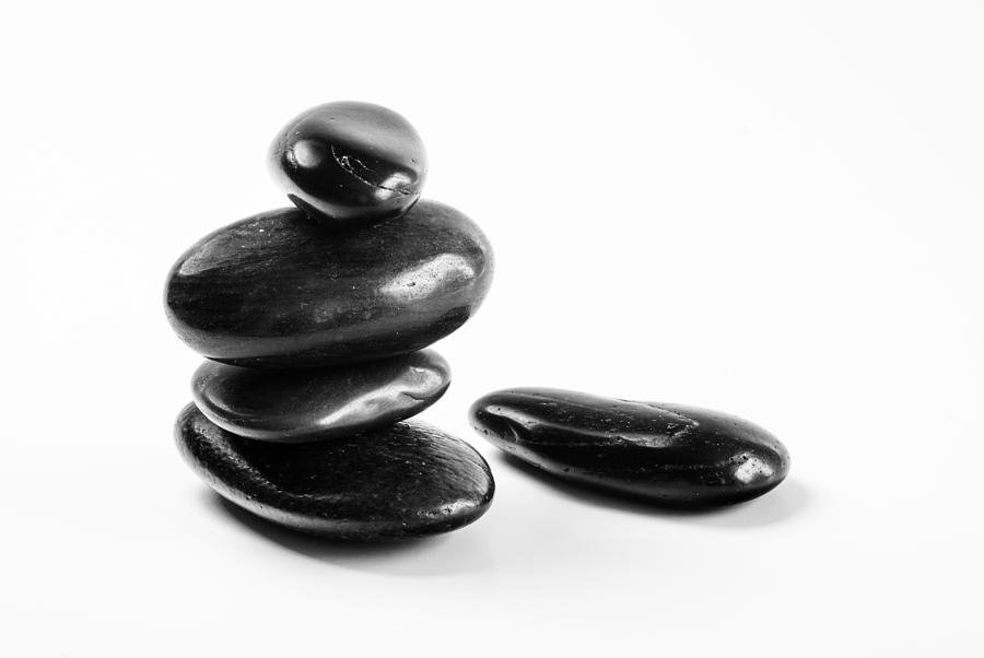 Pebbles Photograph - Black pebbles in monochrome by Vishwanath Bhat