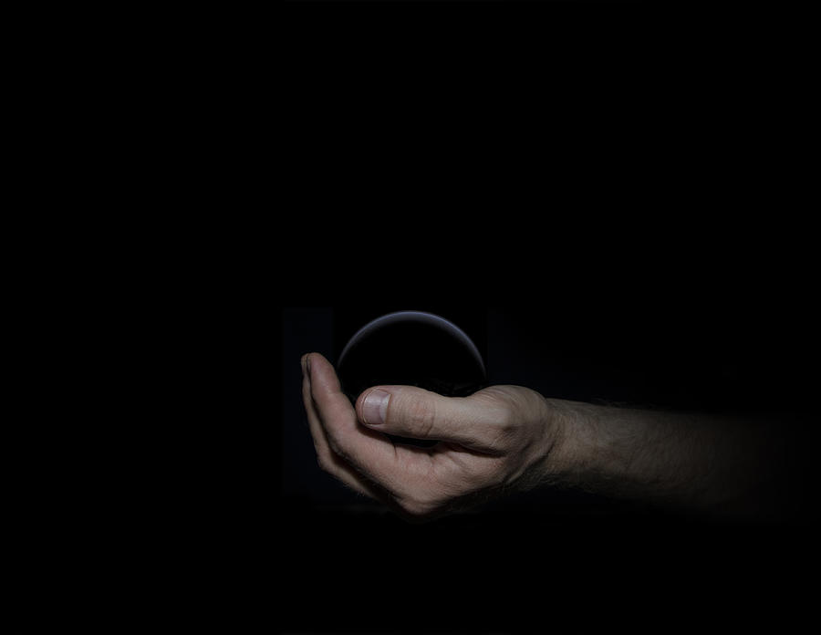 Black Sphere in Hand Digital Art by Pelo Blanco Photo