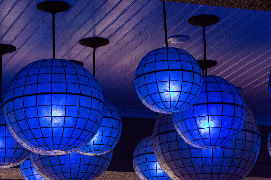 Blue globe lights Photograph by Allan Morrison
