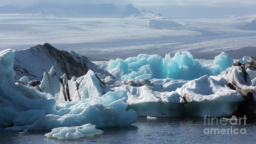 Blue ice in Jokulsarlon Photograph by Agnes Caruso