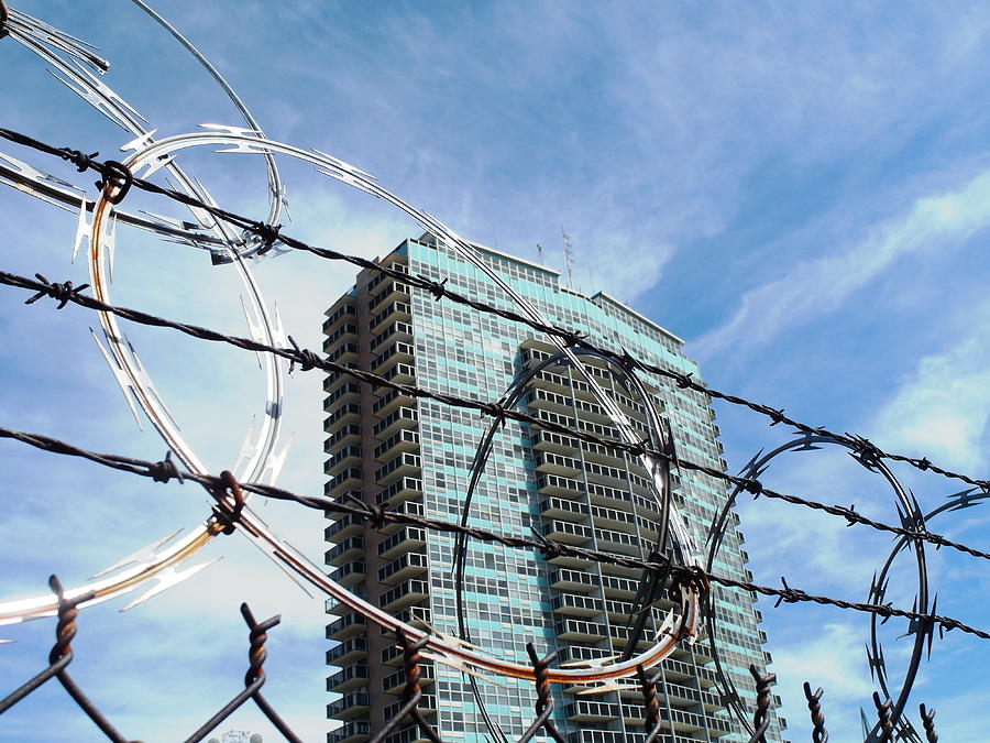 Blue Sky And Barbed Wire Photograph