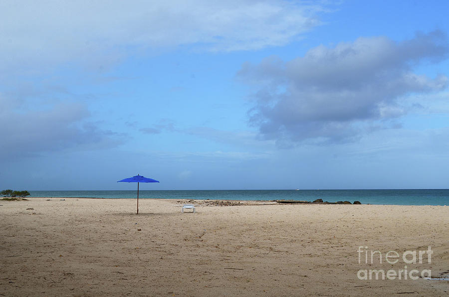 Blue Umbrella and Empty Chair on A Beach in Aruba Photograph by DejaVu Designs