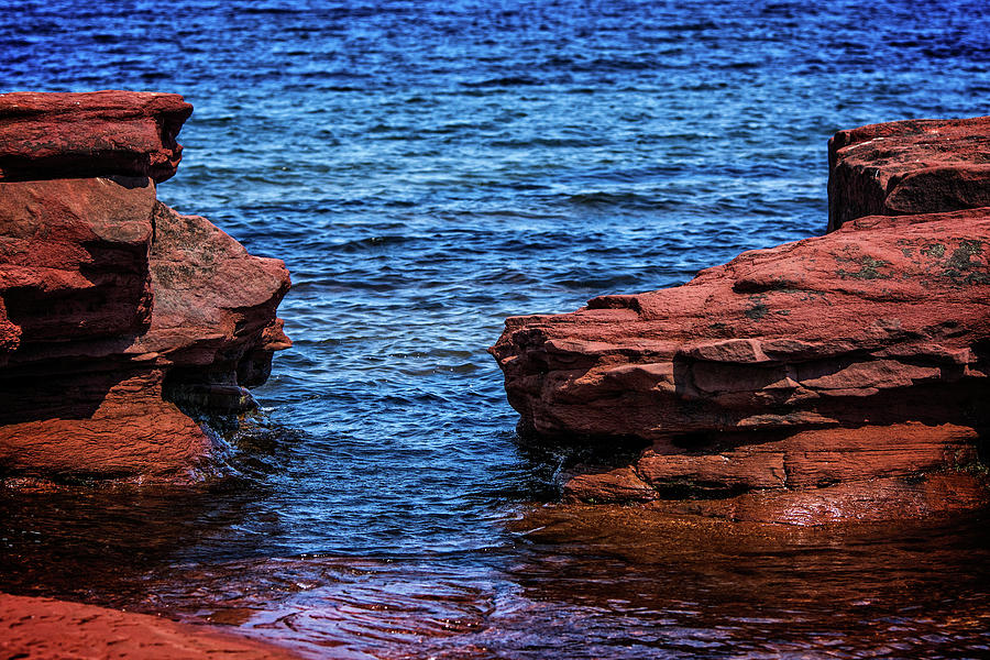 Blue Water Between Red Stone Photograph by Chris Bordeleau