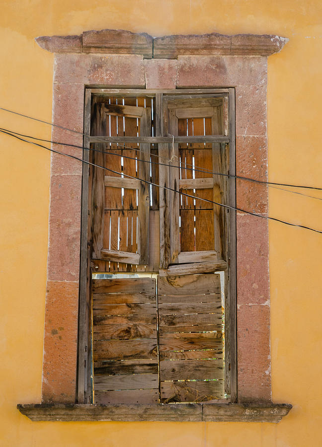Boarded-up window and wires. Photograph by Rob Huntley