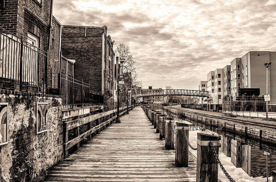 Boardwalk along the Manayunk Canal in Sepia Photograph by Bill Cannon