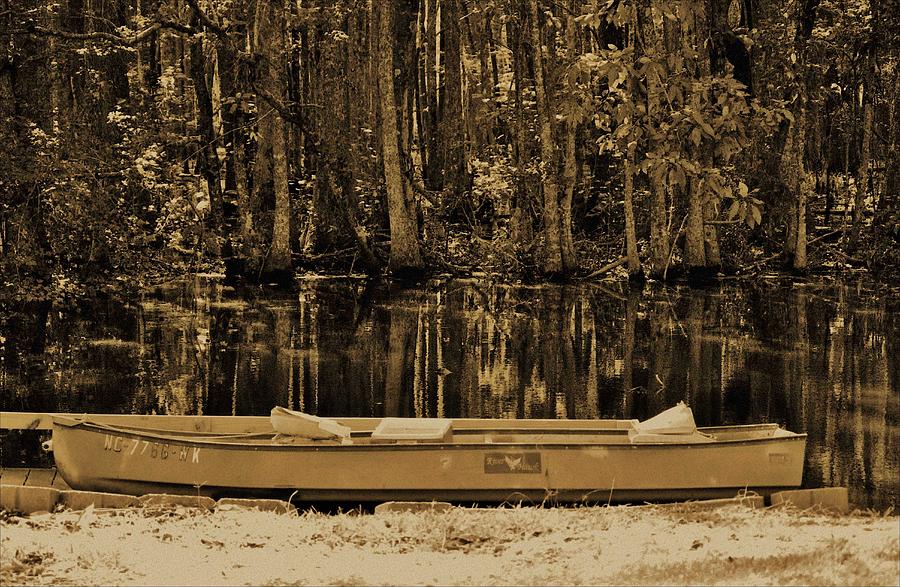 Boat And Swamp Waters Photograph by Cynthia Guinn