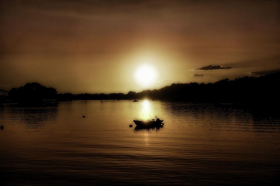 Boat at Sunset glow - sepia  Photograph by Lilia S