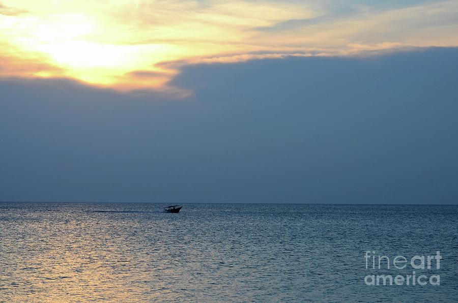 Boat cruises in sea at sunset around waters off Tioman Malaysia Photograph by Imran Ahmed