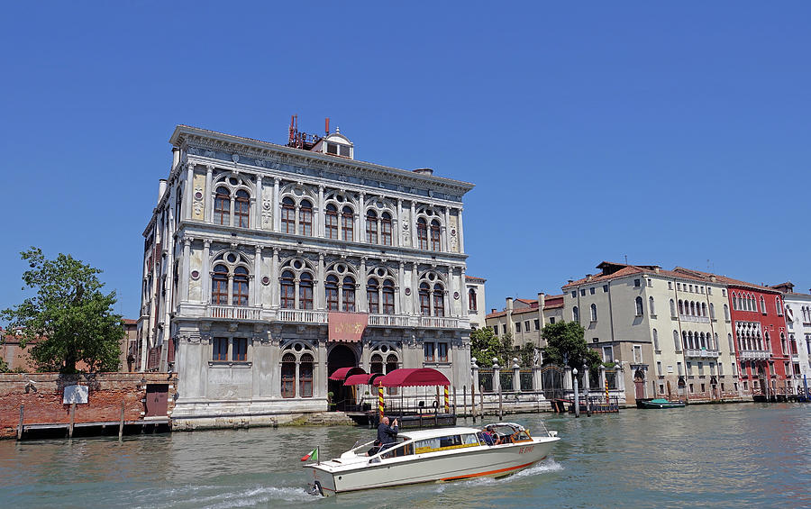 Boat Cruising By The Casino Di Venezia in Venice, Italy Photograph by Rick Rosenshein