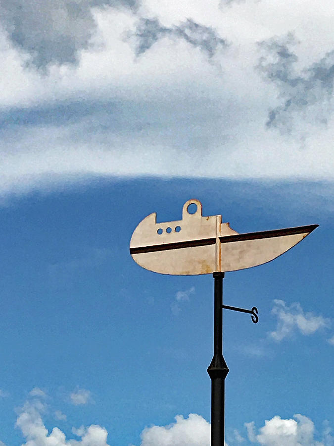 Boat in the Clouds Photograph by Sandy Taylor