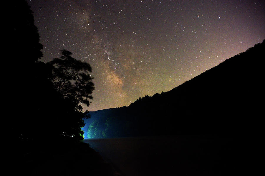 Boat lights in Cheat Lake under the Milky Way Photograph by Dan Friend