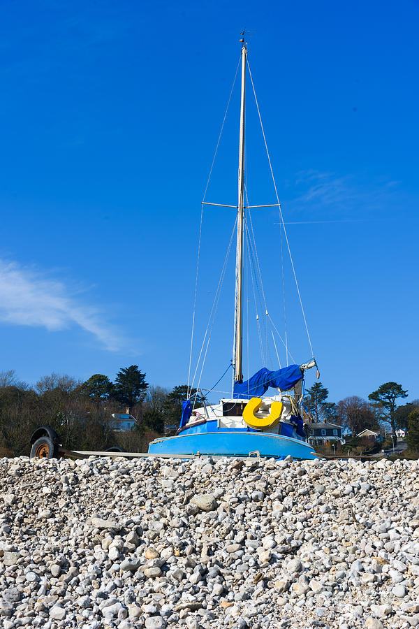 Boat on beach Photograph by Colin Rayner