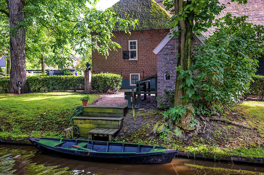 Architecture Photograph - Boat on Canal at Cottage in Giethoorn by Jenny Rainbow