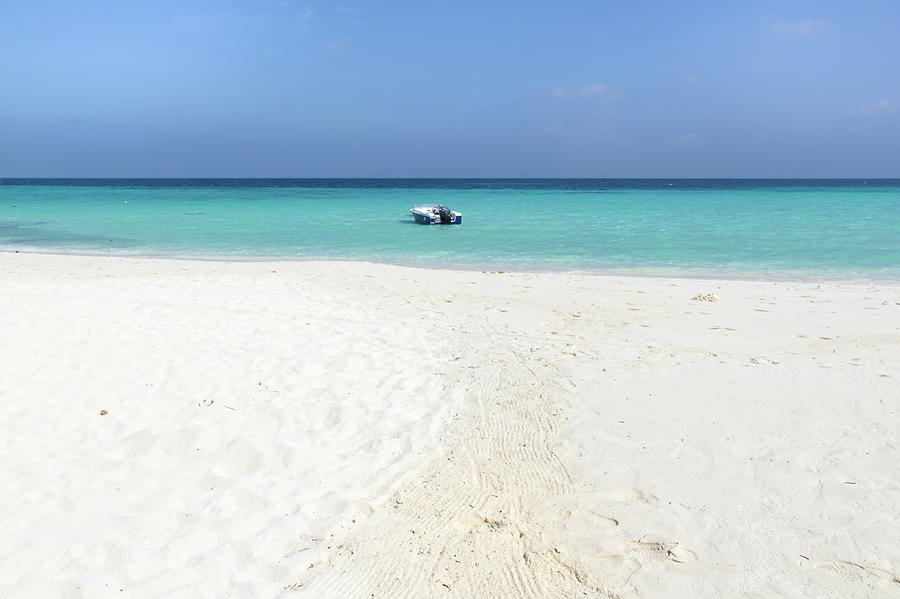 Boat, Sand And Calm Ocean Photograph