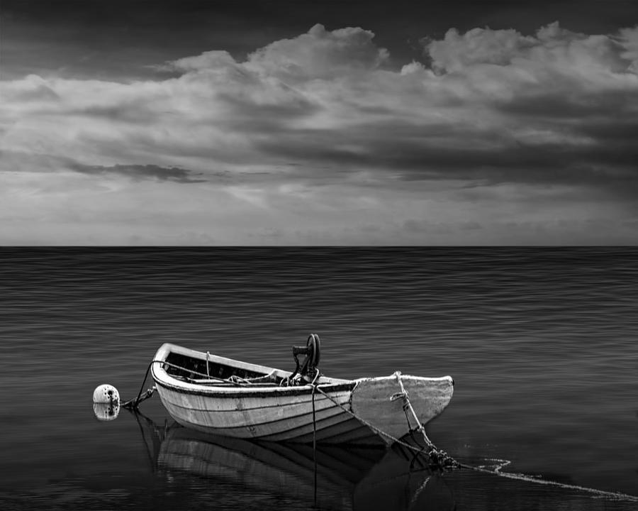 Boat under a Cloudy Sky Photograph by Randall Nyhof