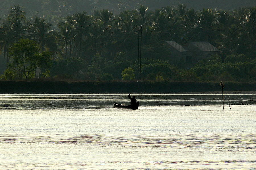 Boatman in the Sun Photograph by Padamvir Singh
