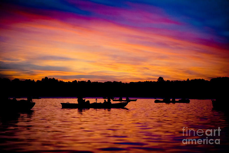Boats and Sunrise above lake water summer time Latvia Ezera skanas Photograph by Raimond Klavins