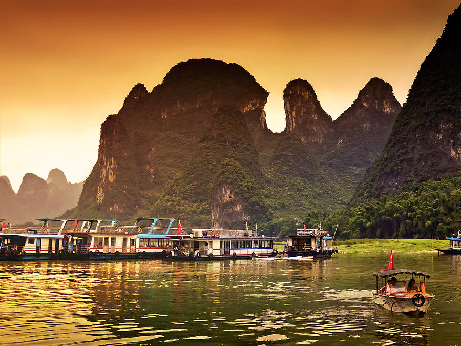 Boats by the river return-China Guilin scenery Lijiang River in Yangshuo Photograph by Artto Pan