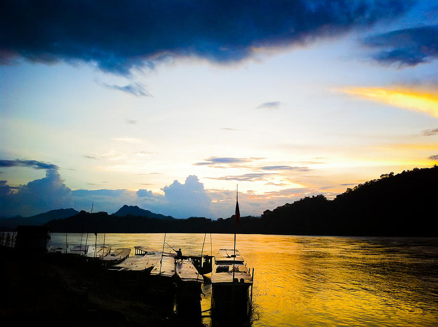 Boats in the Mekong River, Luang Prabang at sunset Photograph by Neil Alexander Photography