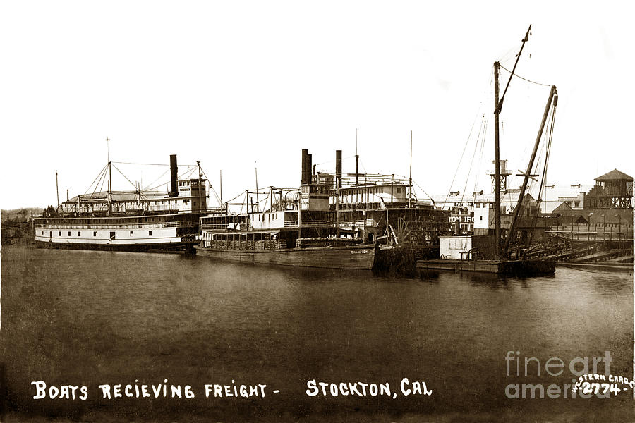 Boat Photograph - Boats recieiving Freight Stockton Calif. Circa 1910 by Monterey County Historical Society