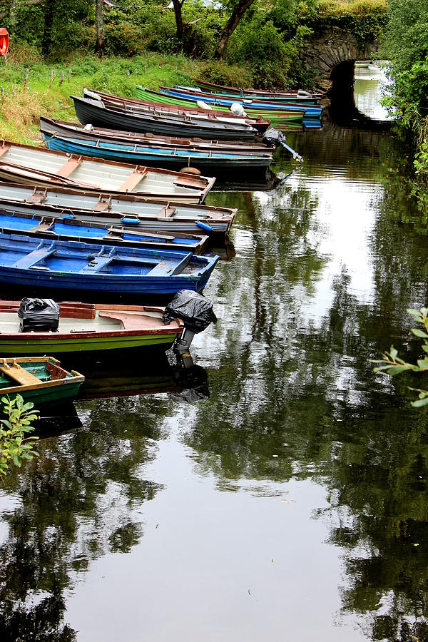 Boats resting on shore Photograph by Toni and Rene Maggio