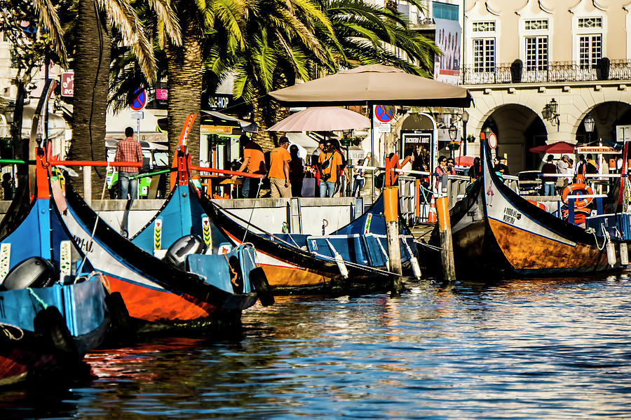 Boats waiting for passengers on  a canal in Portugal Photograph by Sven Brogren