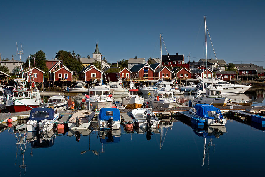 Boats with Reflections in Reine Port Photograph by Aivar Mikko