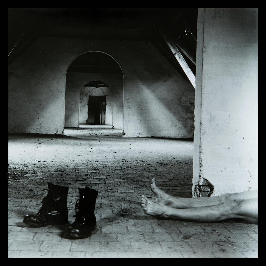 Body on the attic Photograph by Dirk Ercken
