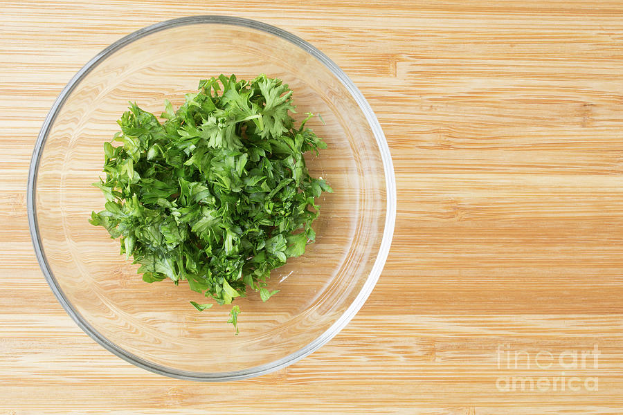 Chopping parsley with a knife, close-up available as Framed Prints, Photos,  Wall Art and Photo Gifts