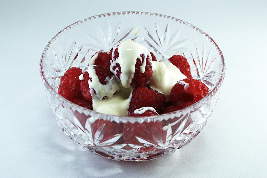 Bowl of Raspberries and cream Photograph by Chris Day