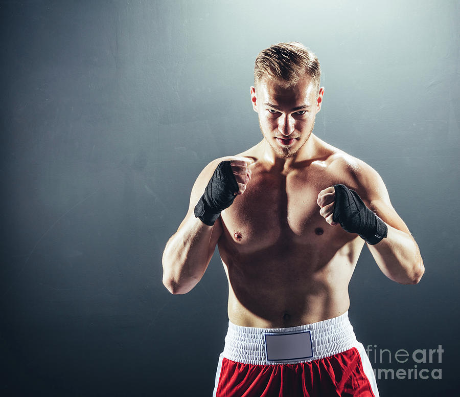 Boxer standing in fighting position. Photograph by Michal Bednarek