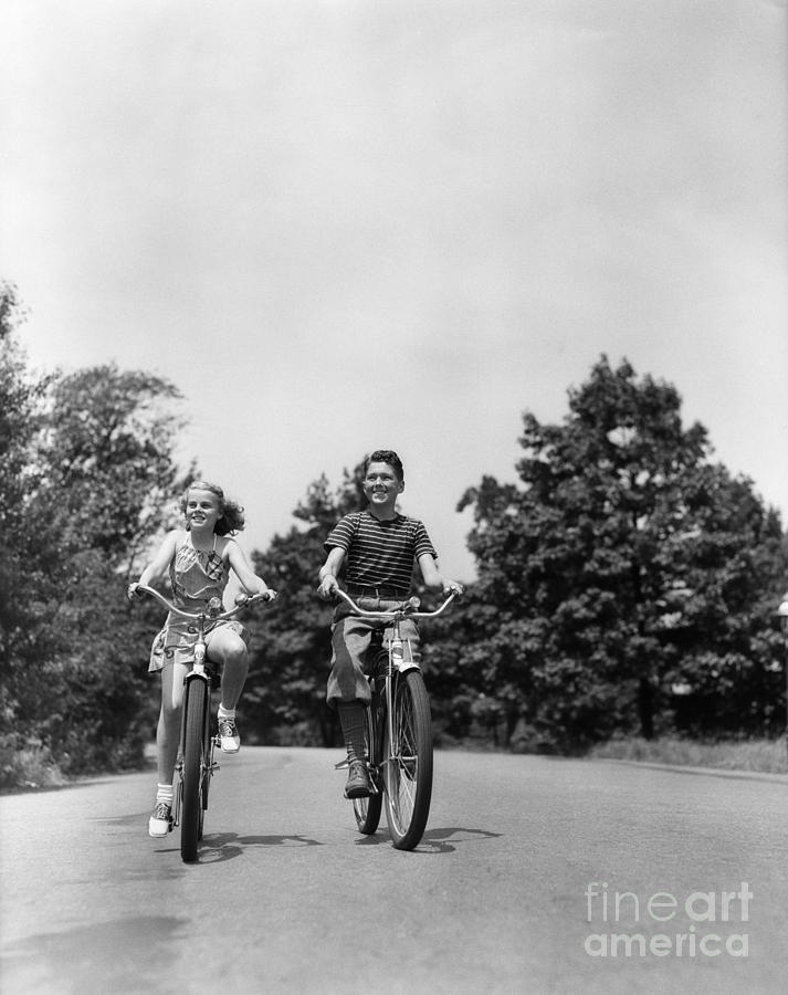 Boy And Girl Riding Bikes, 1940s Photograph by H. Armstrong Roberts/ClassicStock