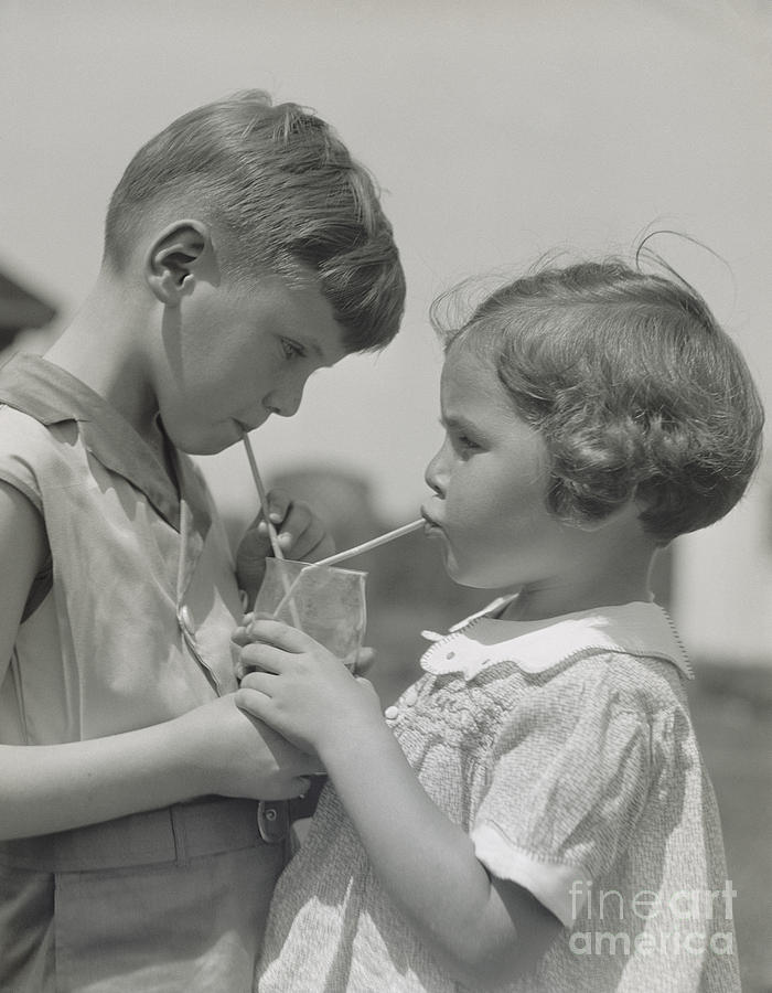 Boy And Girl Sharing A Drink, C. 1930s Photograph by H. Armstrong Roberts/ClassicStock