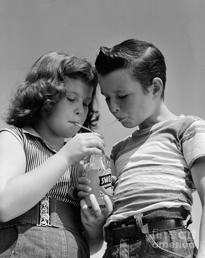 Boy And Girl Sharing A Soda, C.1950s Photograph by H. Armstrong Roberts/ClassicStock