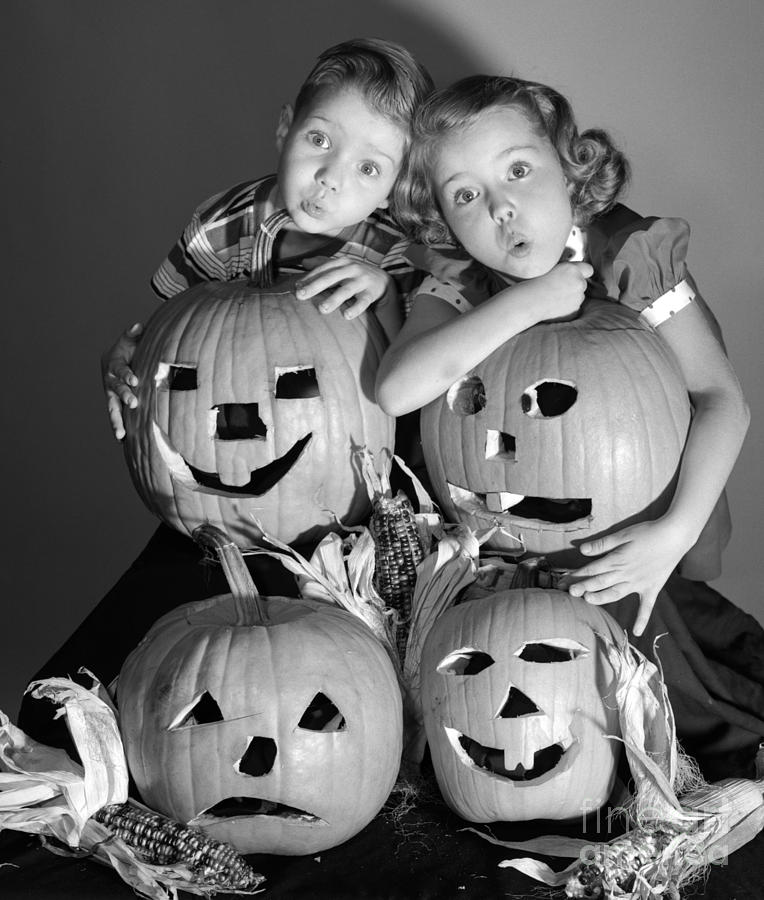 Boy And Girl With Jack-o-lanterns Photograph by Debrocke/ClassicStock