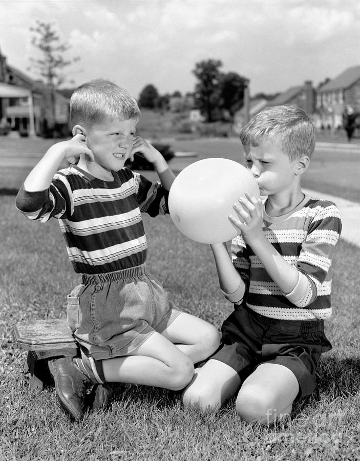 Boy Blowing Balloon While Another Photograph by H. Armstrong Roberts/ClassicStock