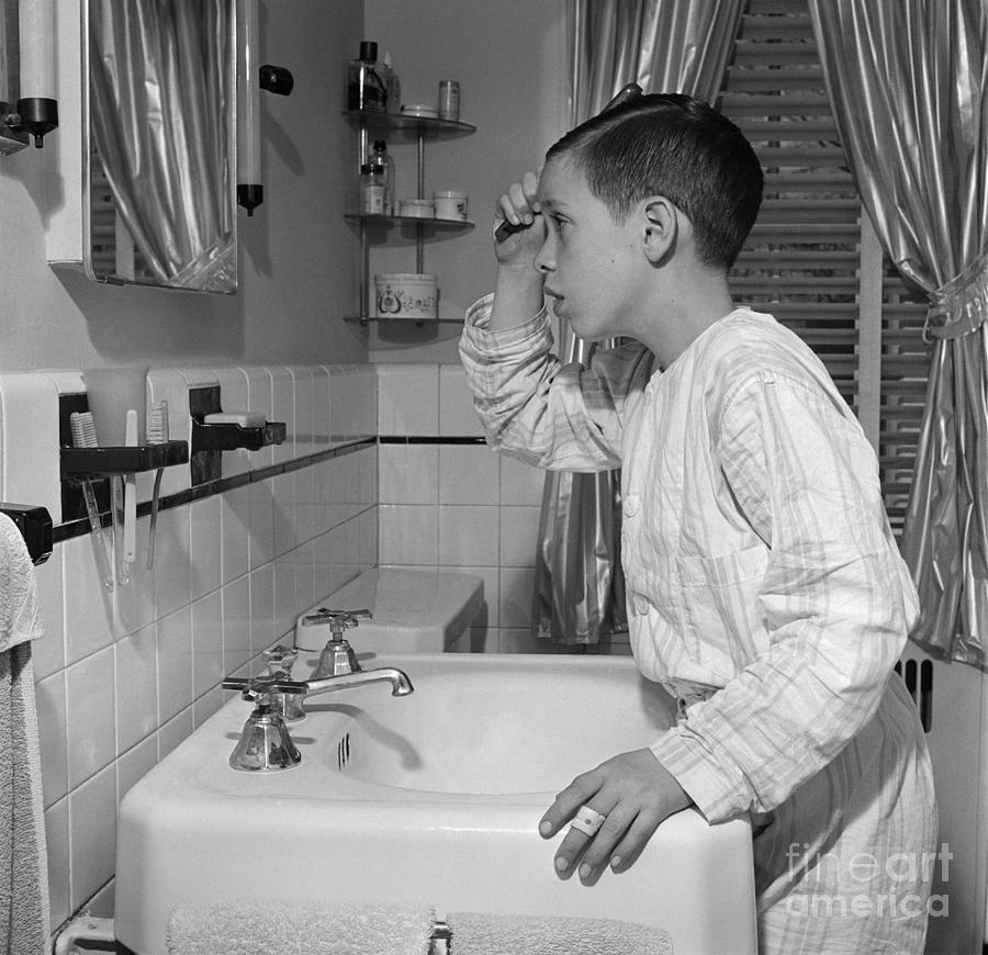 Boy Combing Hair, C.1950s Photograph by E. Hibbs/ClassicStock